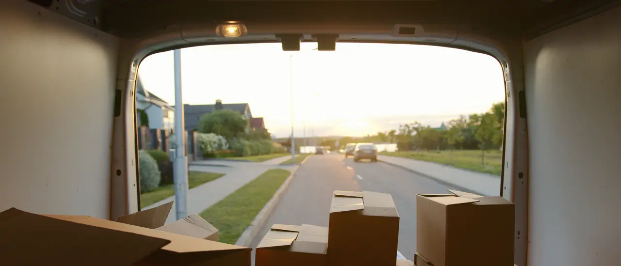 Boxes inside a van, street in the evening light
